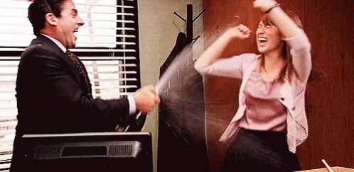 Picture of Michael and Erin celebrating in The Office