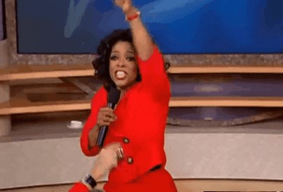 Picture of Oprah announcing "You get a car, you get a car, everybody gets a car"