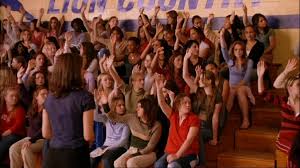A picture of girls raising their hands from the movie Mean Girls